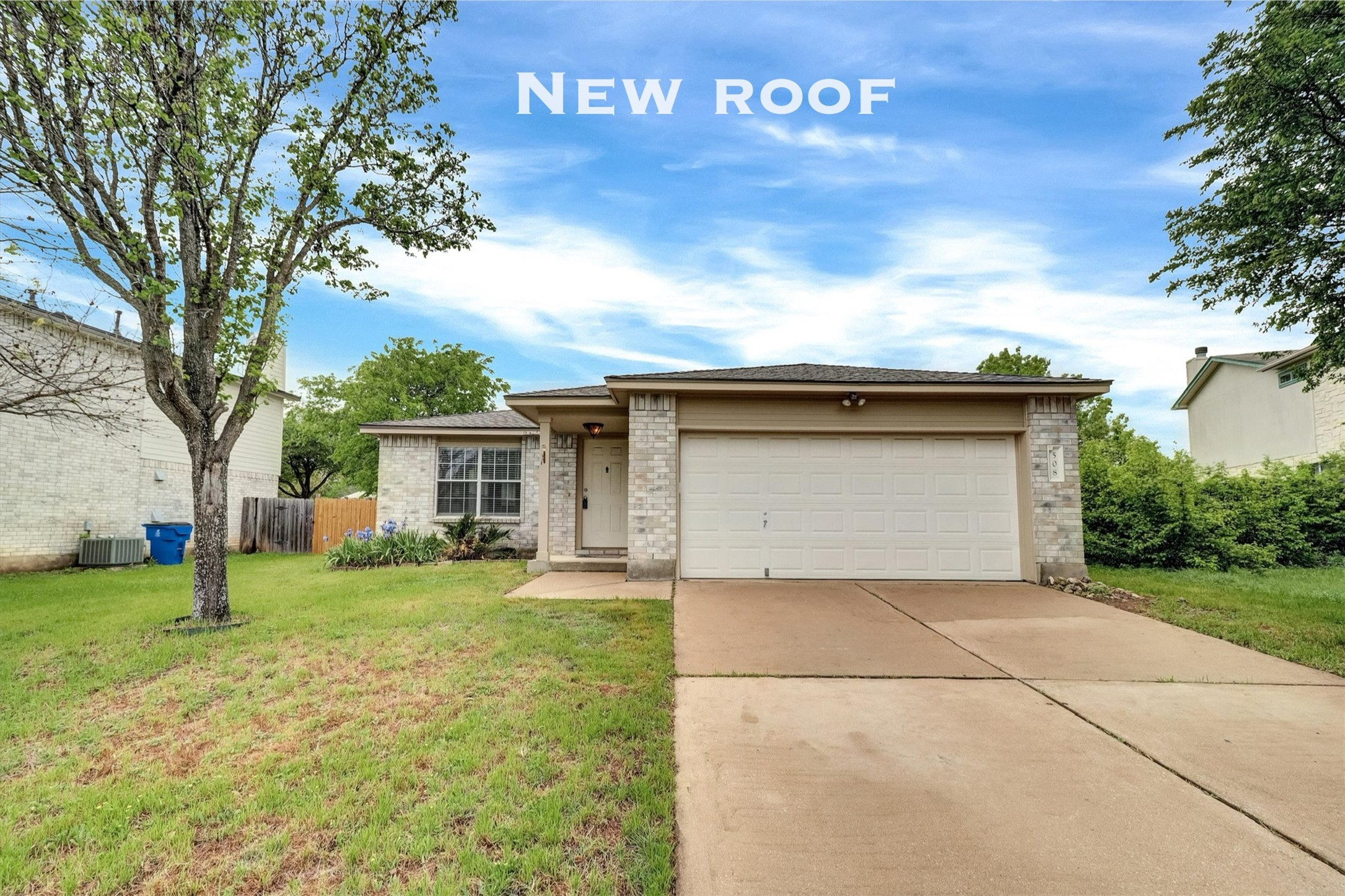 508 Cripple Creek Road Cedar Park, TX 78613 - Photo 1 of 1 Ranch-style house featuring concrete driveway, fence, an attached garage, brick siding, and a front lawn