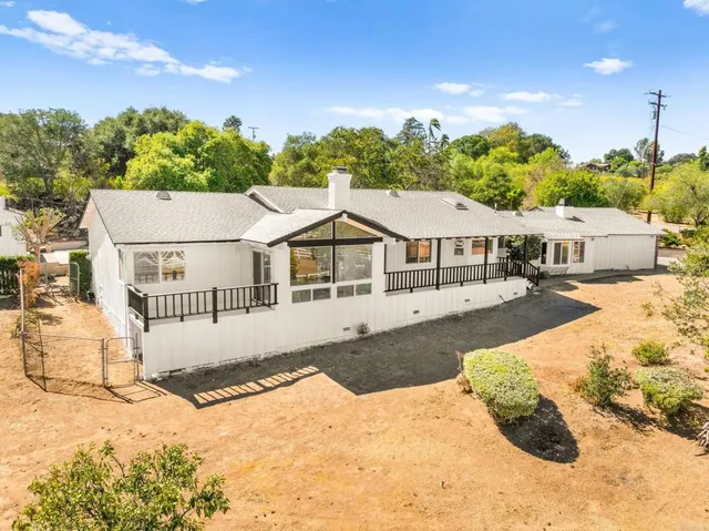 a view of a livingroom with an empty space and a fireplace