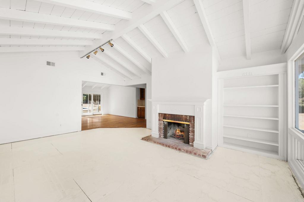758 Verde Avenue Fallbrook, CA 92028 - Photo 19 of 71 a view of empty room with a fireplace and window