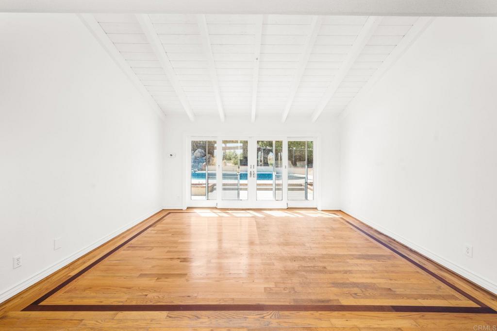 758 Verde Avenue Fallbrook, CA 92028 - Photo 22 of 71 a view of an empty room with wooden floor and a window