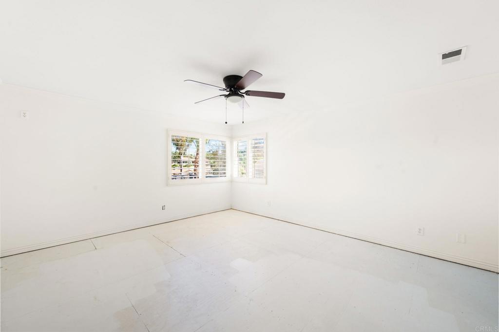 758 Verde Avenue Fallbrook, CA 92028 - Photo 25 of 71 an empty room with chandelier fan and windows