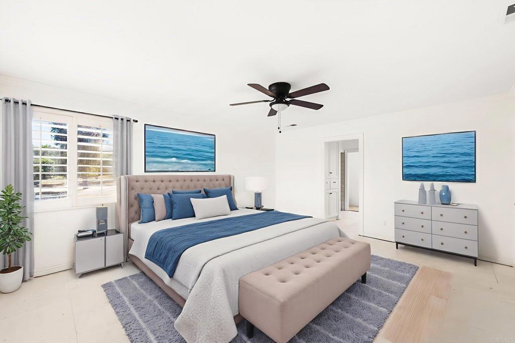 758 Verde Avenue Fallbrook, CA 92028 - Photo 27 of 71 a spacious bedroom with a bed and a chandelier