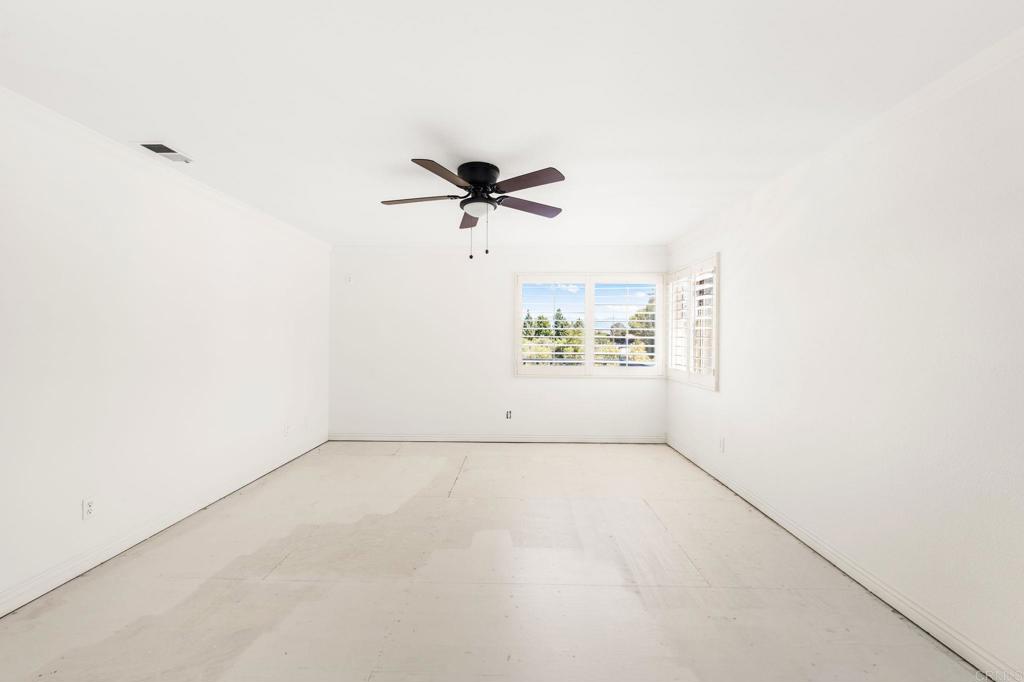 758 Verde Avenue Fallbrook, CA 92028 - Photo 28 of 71 an empty room with a window and a ceiling fan
