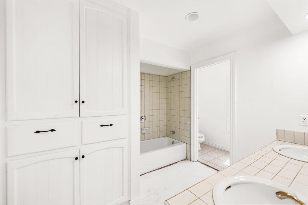 758 Verde Avenue Fallbrook, CA 92028 - Photo 30 of 71 a bathroom with a bathtub and shower