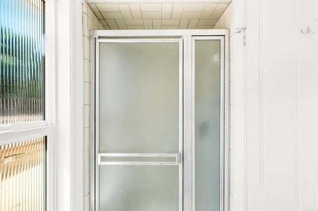 a view of an empty room with a window