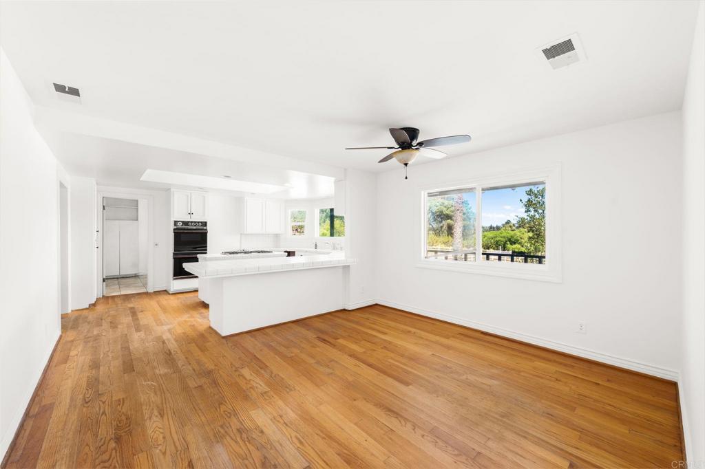 758 Verde Avenue Fallbrook, CA 92028 - Photo 33 of 71 a view of kitchen with stainless steel appliances kitchen island a sink and wooden floor