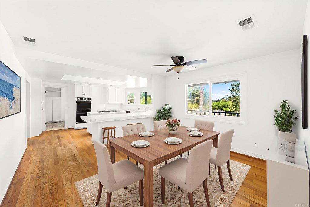 758 Verde Avenue Fallbrook, CA 92028 - Photo 34 of 71 a view of a dining room with furniture and a potted plant