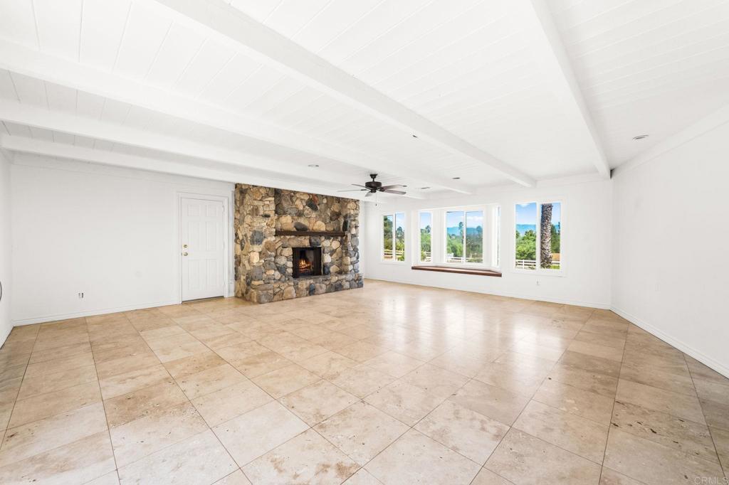 758 Verde Avenue Fallbrook, CA 92028 - Photo 47 of 71 an empty room with fireplace and windows