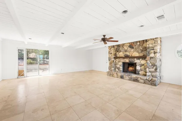 a view of a house with backyard and trees