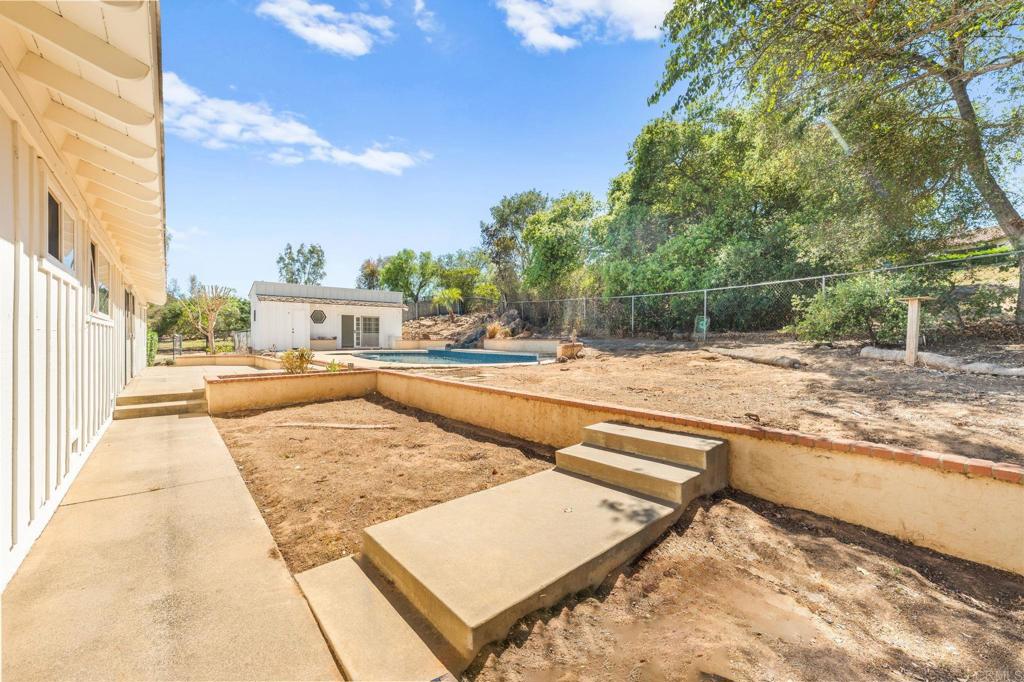 758 Verde Avenue Fallbrook, CA 92028 - Photo 51 of 71 a view of a swimming pool with a lounge chairs