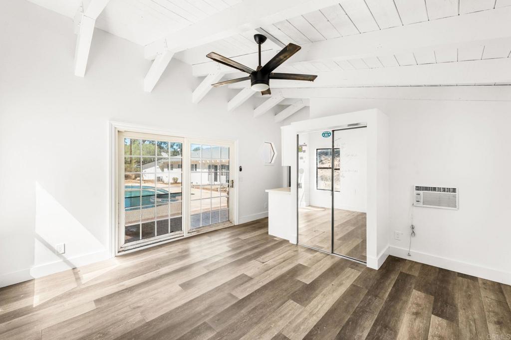 758 Verde Avenue Fallbrook, CA 92028 - Photo 59 of 71 a view of a livingroom with wooden floor and a ceiling fan