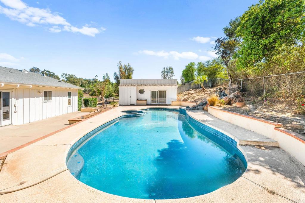758 Verde Avenue Fallbrook, CA 92028 - Photo 65 of 71 a view of a swimming pool with a lounge chairs