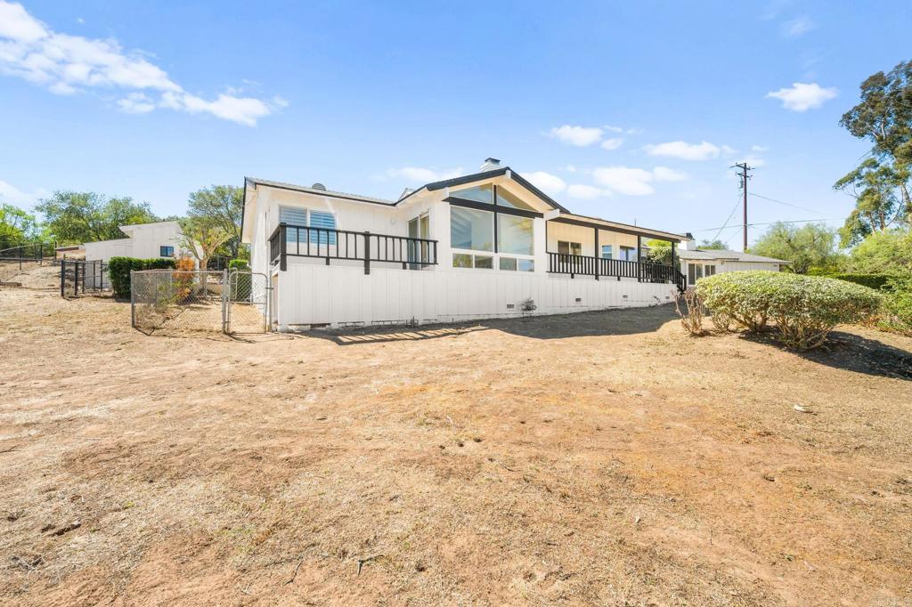 758 Verde Avenue Fallbrook, CA 92028 - Photo 8 of 71 a front view of a house with a yard