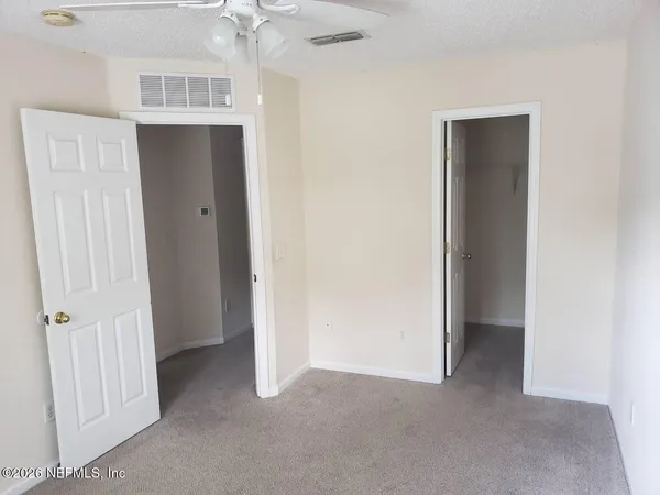 an empty room with a bathroom