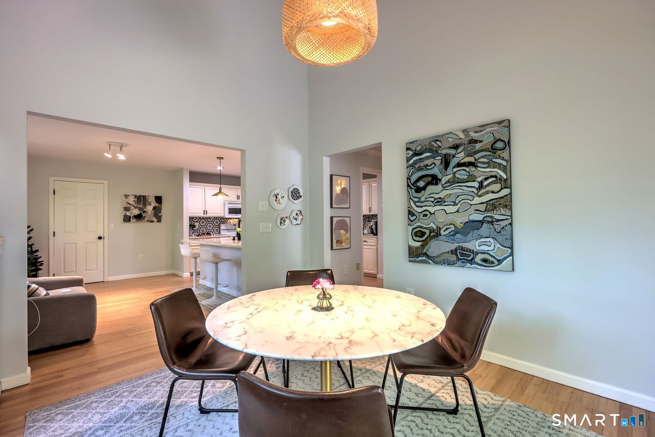 9 Canterbury Road, Unit 9 Hamden, CT 06514 - Photo 13 of 29 a view of a dining room with furniture and wooden floor