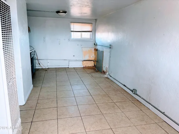a view of an empty room and a window
