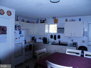 110 Perth Way Shepherdstown, WV 25443 - Photo 3 of 6 a kitchen with cabinets a sink and a stove