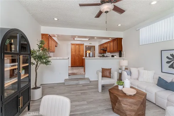 a living room with furniture and a bookshelf