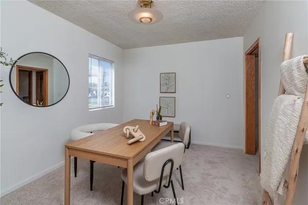 a view of a dining room with furniture
