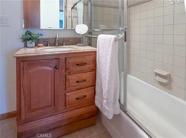 a bathroom with a bathtub and a sink