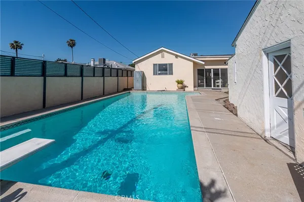a view of a backyard of the house