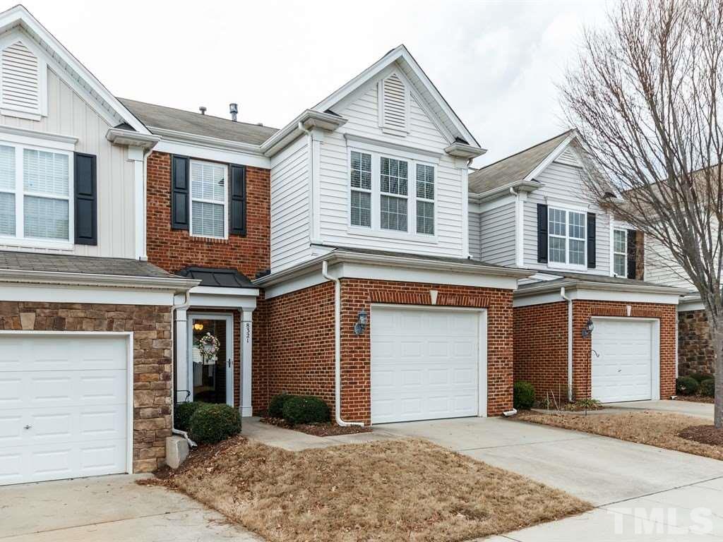 8321 Pilots View Drive Raleigh, NC 27617 - Photo 2 of 25 a front view of a house with a yard and garage