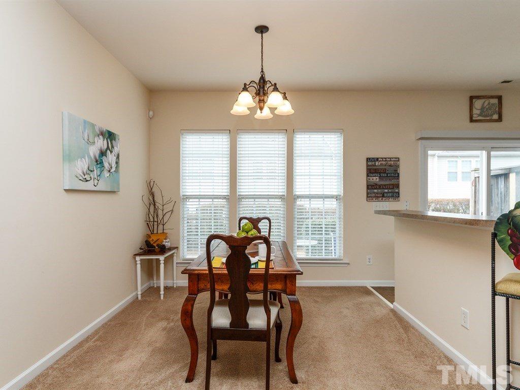 8321 Pilots View Drive Raleigh, NC 27617 - Photo 11 of 25 a view of a dining room with furniture window and outside view