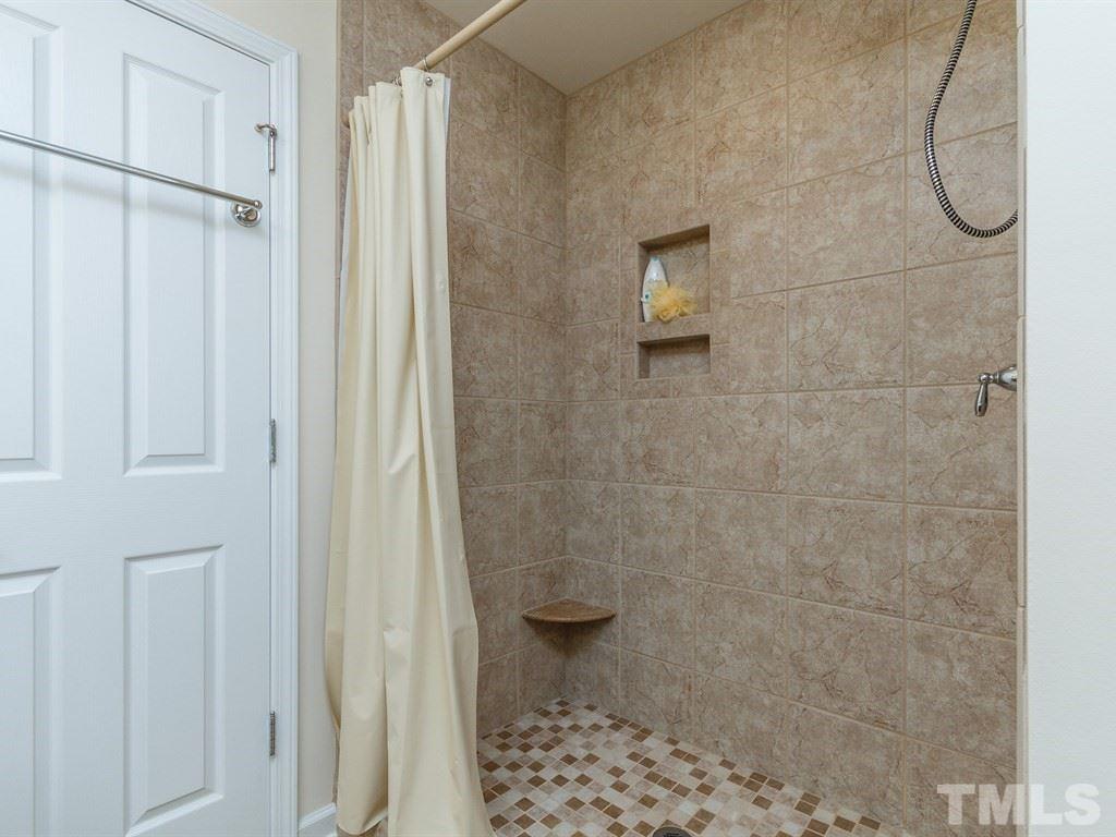 8321 Pilots View Drive Raleigh, NC 27617 - Photo 19 of 25 a bathroom with a glass shower door