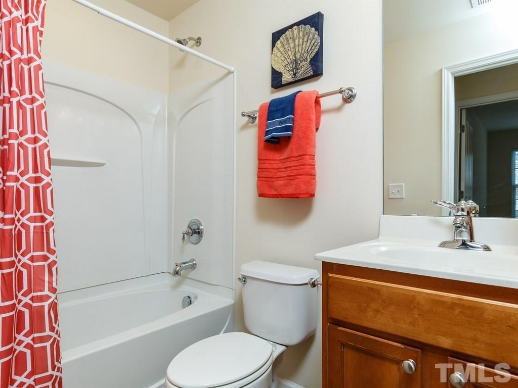 8321 Pilots View Drive Raleigh, NC 27617 - Photo 20 of 25 a bathroom with a sink toilet and shower