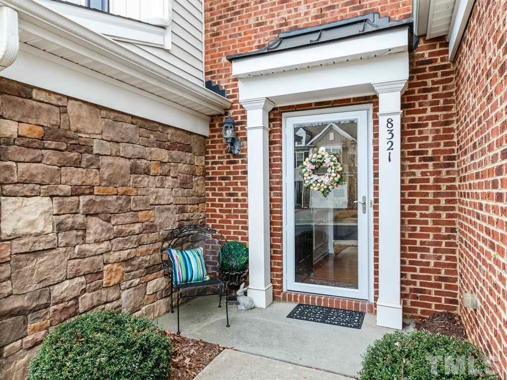 8321 Pilots View Drive Raleigh, NC 27617 - Photo 3 of 25 a front view of a house with a garden