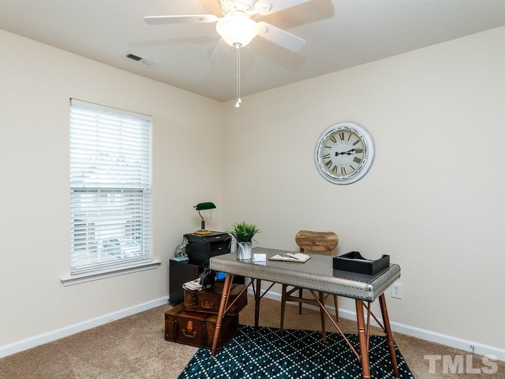 8321 Pilots View Drive Raleigh, NC 27617 - Photo 21 of 25 a view of a workspace with furniture and a window