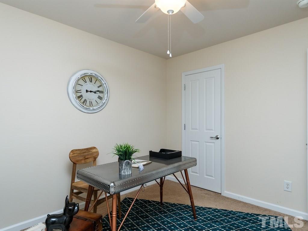 8321 Pilots View Drive Raleigh, NC 27617 - Photo 22 of 25 a view of a room with a table and chairs
