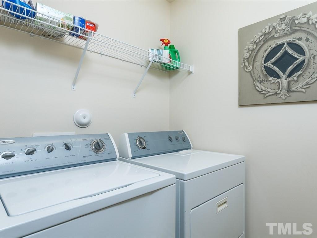 8321 Pilots View Drive Raleigh, NC 27617 - Photo 23 of 25 a utility room with dryer and washer