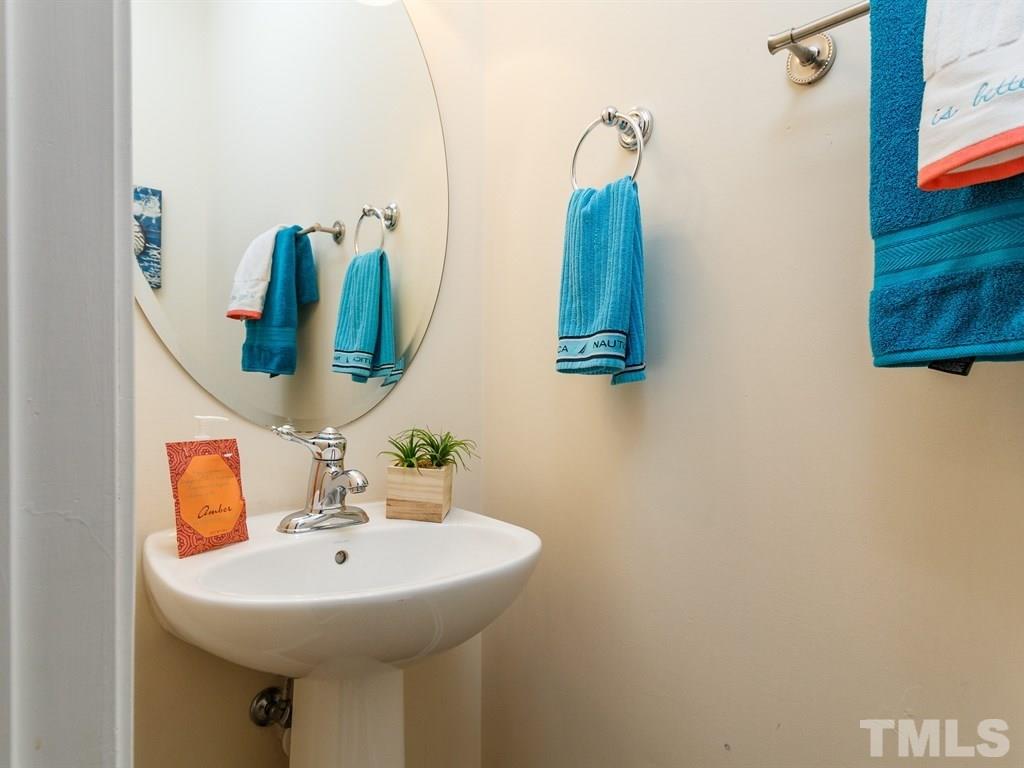 8321 Pilots View Drive Raleigh, NC 27617 - Photo 24 of 25 a bathroom with a sink and a mirror