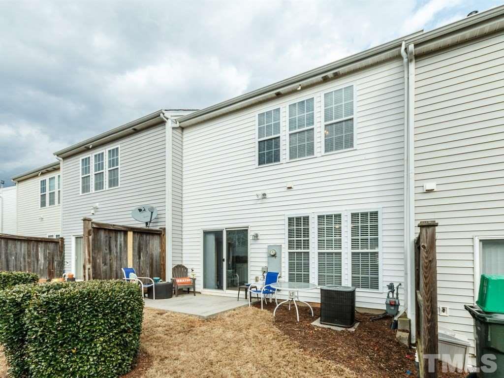 8321 Pilots View Drive Raleigh, NC 27617 - Photo 4 of 25 a front view of a house with large windows