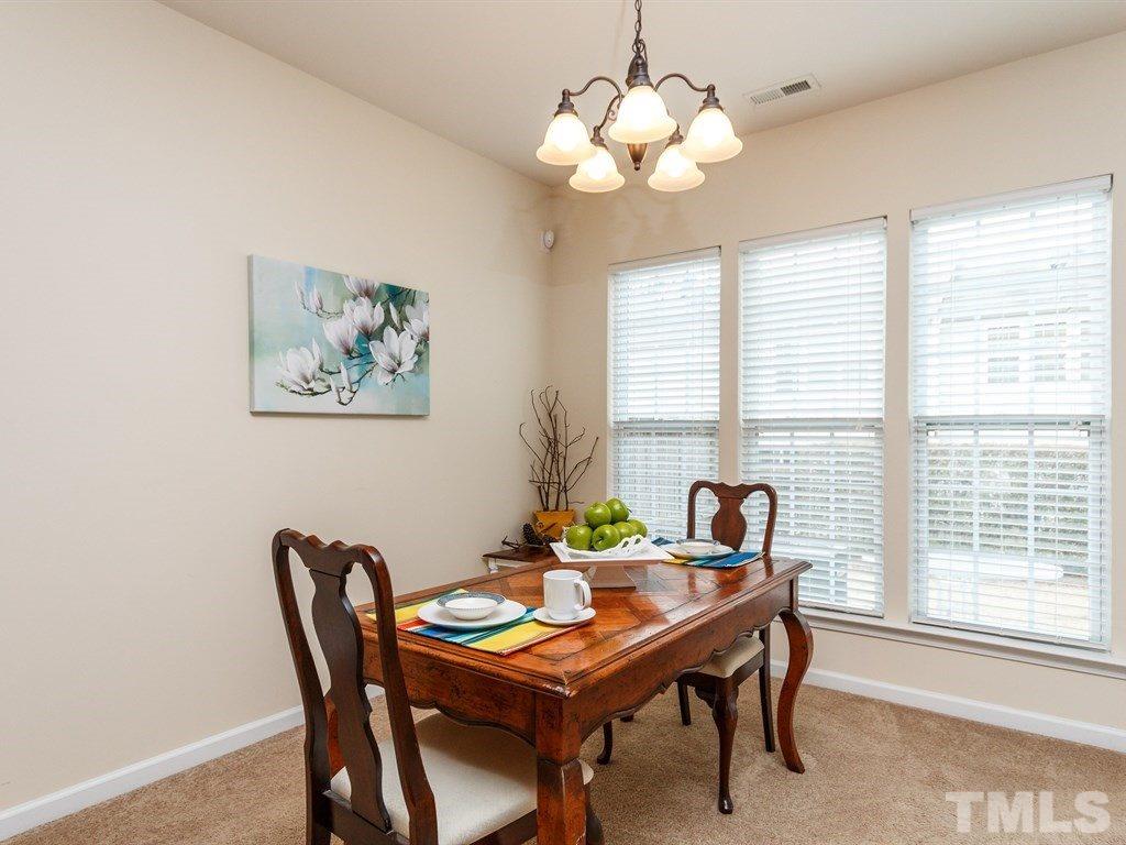 8321 Pilots View Drive Raleigh, NC 27617 - Photo 10 of 25 a view of a dining room with furniture window and outside view