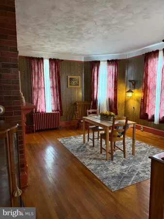 a view of a livingroom with furniture and window