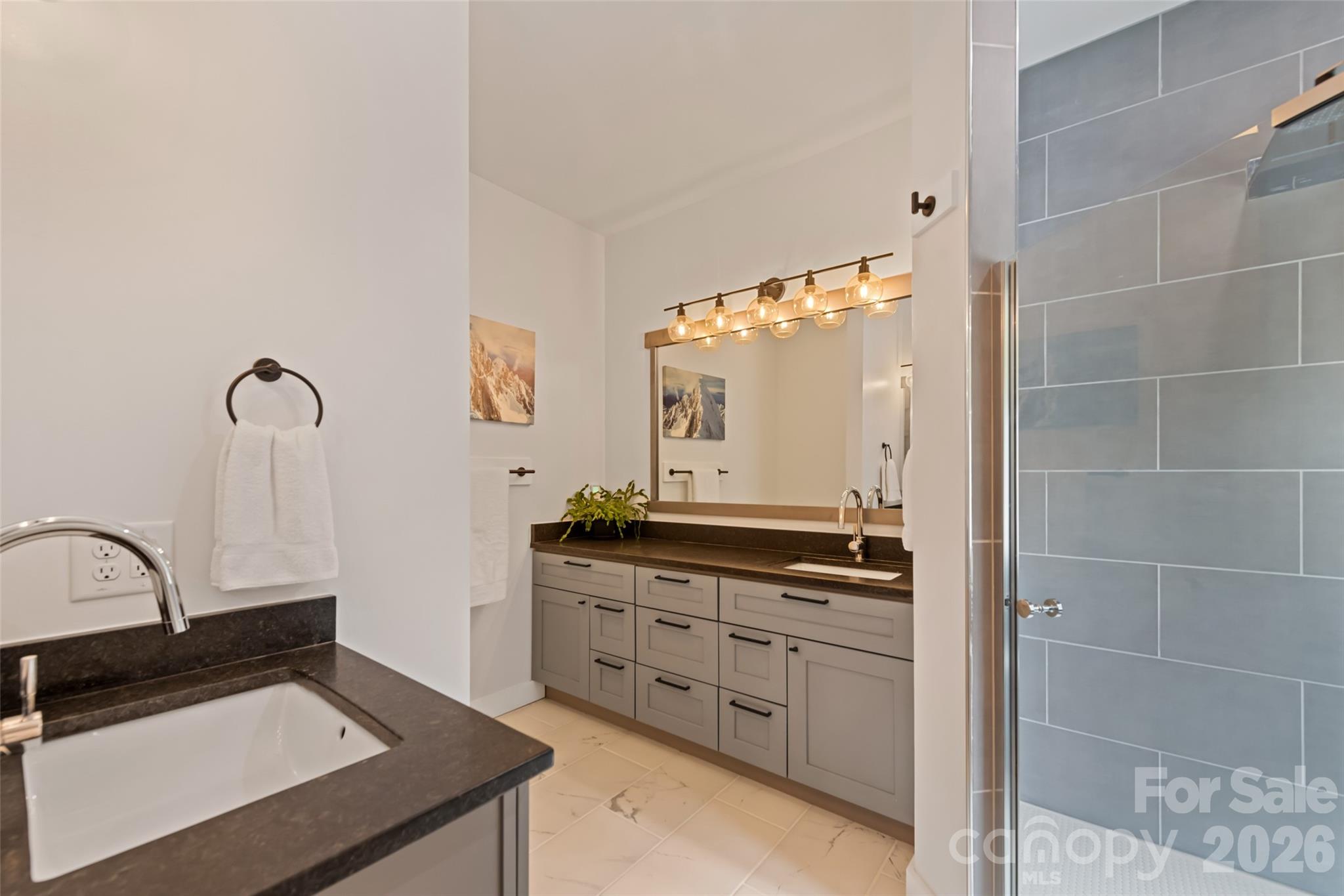 1185 Wallalieu Road Otto, NC 28763 - Photo 23 of 43 a kitchen with a sink and cabinets