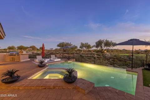 a large kitchen with stainless steel appliances granite countertop a lot of counter space and wooden floor