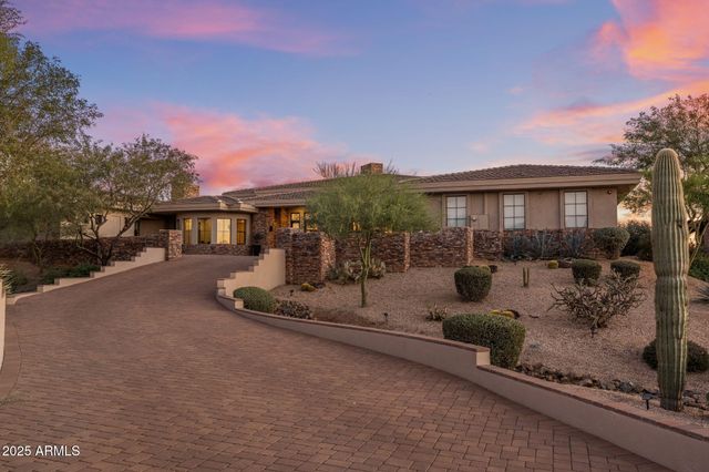 a view of a patio with couches and pool