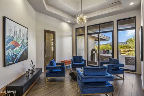 a very nice looking living room with furniture and a large window