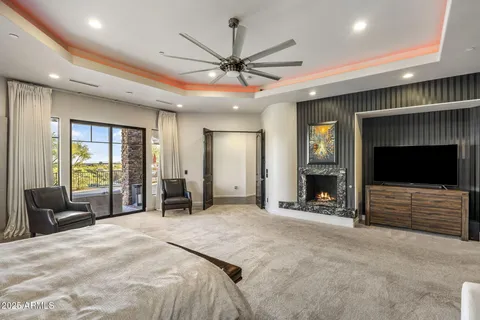 a bathroom with a granite countertop sink a mirror and shower
