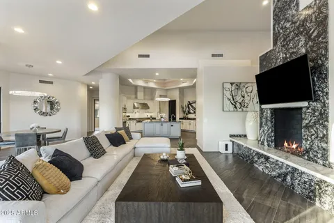 a view of a town with mountains in the background