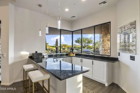 an aerial view of a residential houses with outdoor space