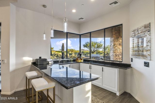 an aerial view of a residential houses with outdoor space