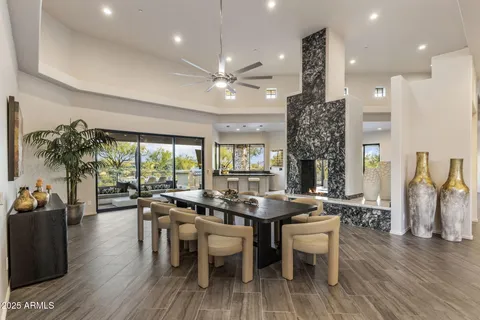 an aerial view of a house with a yard and lake view