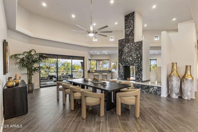 an aerial view of a house with a yard and lake view