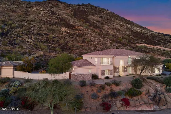 a terrace of a house with outdoor seating