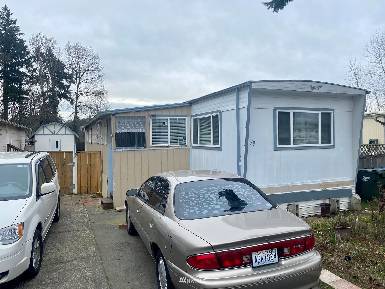 15232 Southeast 272nd Street, Unit 99 Kent, WA 98042 - Photo 1 of 15 a front view of a house with balcony and furniture