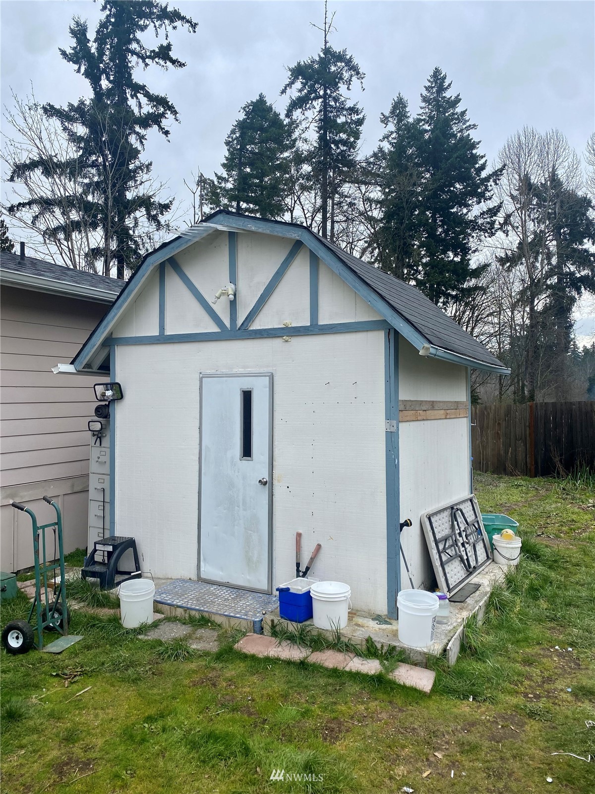 15232 Southeast 272nd Street, Unit 99 Kent, WA 98042 - Photo 14 of 15 a front view of a house with garden